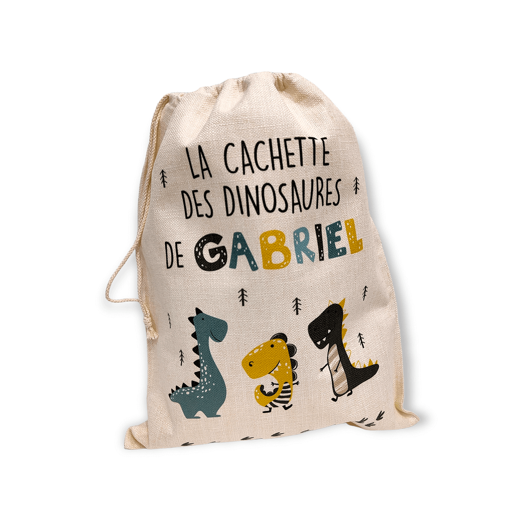 Sac à jouets pour enfant sur le thème des dinosaures. Pour une chambre bien rangée. Personnalisable au prénom de votre enfant.